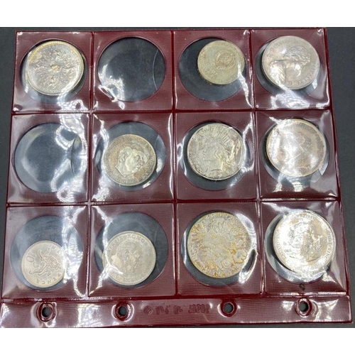 570 - A selection of coins to include: A Marie Theresa, Russian Rouble, 1927 USA silver dollar etc.