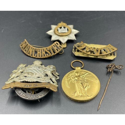 574 - A small selection of Military insignia and a WWI Ware Medal for 54147 PTE W C WEEKS MANCH R