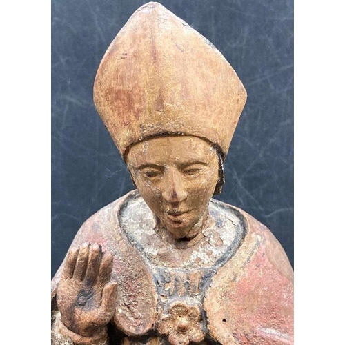 592 - A wooden carved statue of Saint Blaise the bishop of Sebask, possibly 14th Century