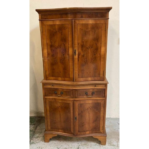 6 - A yew bow fronted single drawer two cupboard drink cabinet (H150cm W70cm D40cm)