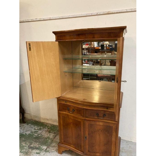 6 - A yew bow fronted single drawer two cupboard drink cabinet (H150cm W70cm D40cm)