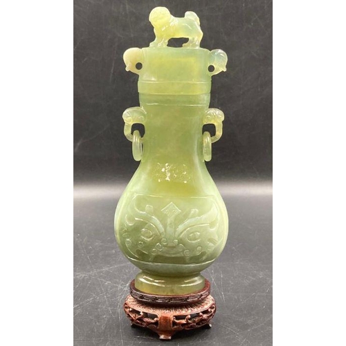 605 - Two jade vases and a jade stamp