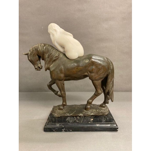 606 - A bronze sculpture of The Pacing Horse with a marble lady astride titled Isabeau and signed by the s... 