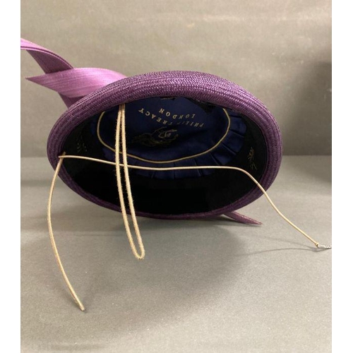 608 - A purple fascinator with purple sculpted twist intertwined with faux rose detail