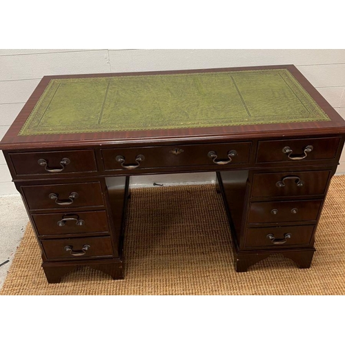 62 - A mahogany pedestal desk with green leather top (H77cm W120cm D61cm)