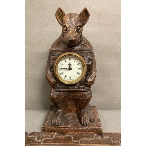 621 - A Black Forest wood clock and a pair of adjustable bookends.