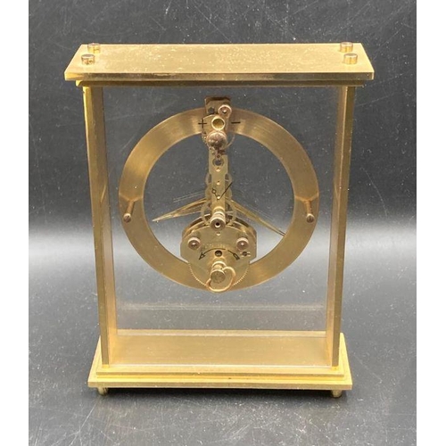 628 - Two clocks, A Roskoff and Co glass spherical desk clock and a carriage clock by Kaiser