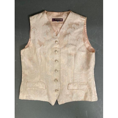 630 - Two vintage Liberty waistcoats. One pale pink damask and one in a crushed velvet with gold button de... 