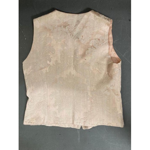 630 - Two vintage Liberty waistcoats. One pale pink damask and one in a crushed velvet with gold button de... 