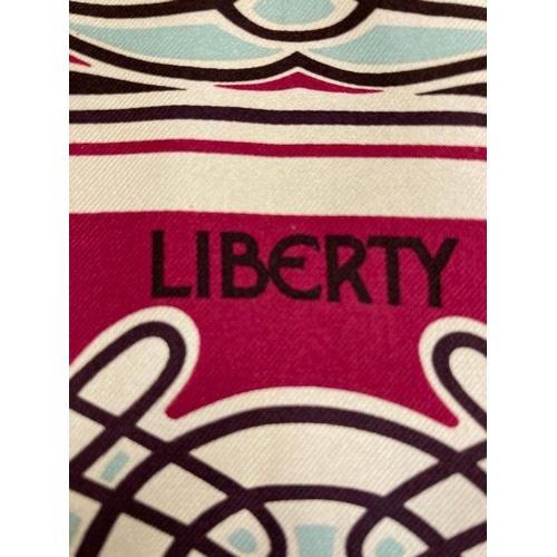 631 - Two vintage Art nouveau Liberty silk scarves. One in purples and pinks and the other in blues, reds ... 