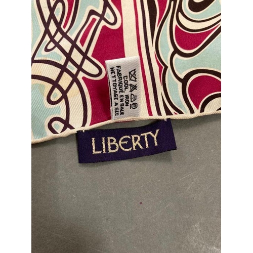 631 - Two vintage Art nouveau Liberty silk scarves. One in purples and pinks and the other in blues, reds ... 