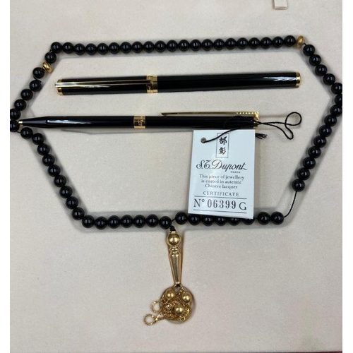 635 - A cased S T Dupont Laque de Chine two pen and necklace set