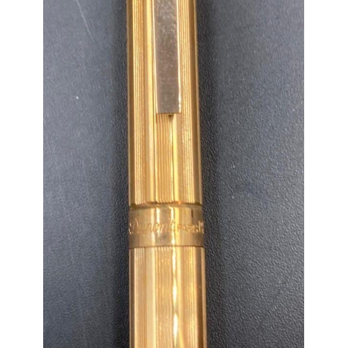 636 - An S T Dupont of Paris biro in gold metal with paper, along with a silver metal S T Dupont biro, box... 