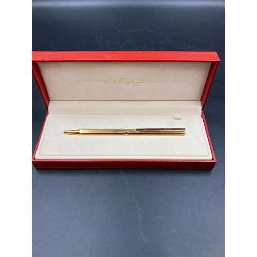 636 - An S T Dupont of Paris biro in gold metal with paper, along with a silver metal S T Dupont biro, box... 