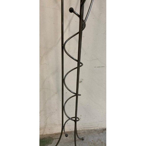 651 - A six arm wrought iron floor standing candle holder