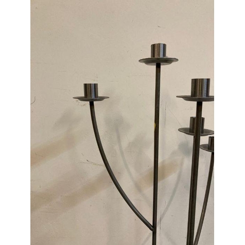 651 - A six arm wrought iron floor standing candle holder