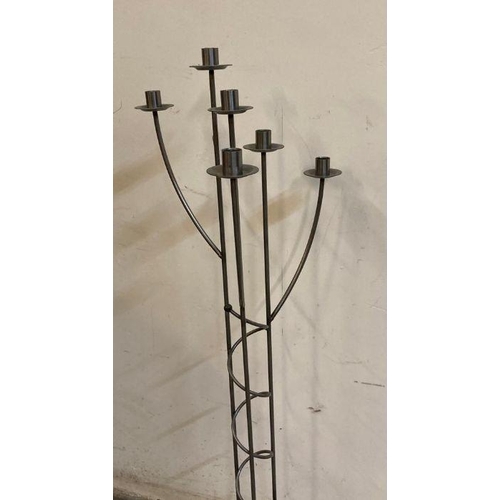 651 - A six arm wrought iron floor standing candle holder