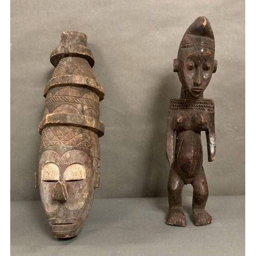 652 - A selection of African to include a traditional mask and an figure