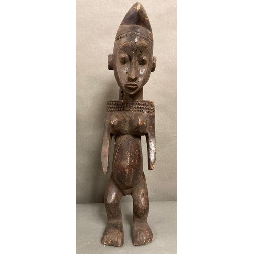 652 - A selection of African to include a traditional mask and an figure