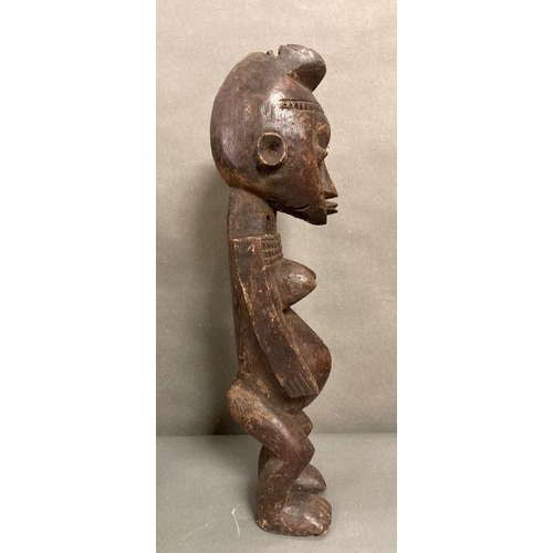 652 - A selection of African to include a traditional mask and an figure