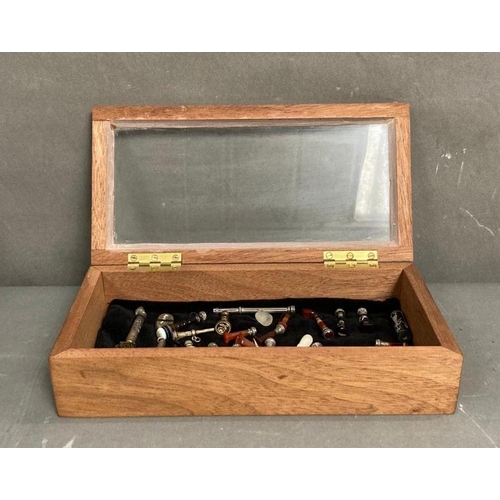 655 - A portable display case containg a collection of antique stamps