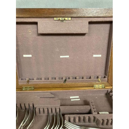 659 - An oak canteen of white metal and silver plate cutlery