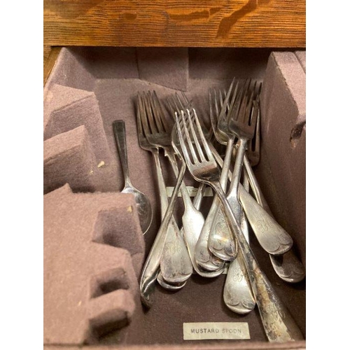 659 - An oak canteen of white metal and silver plate cutlery