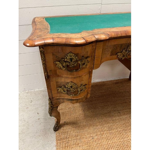 67 - An early 19th Century Italian walnut shaped front desk on cabriole legs with substation gilt metal m... 