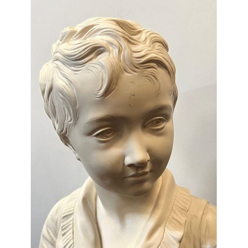 674 - A bust of a boy on a marble base signed Houdon 1875