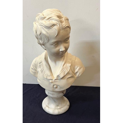 674 - A bust of a boy on a marble base signed Houdon 1875