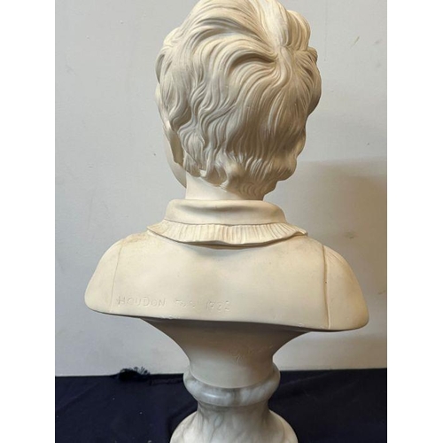 674 - A bust of a boy on a marble base signed Houdon 1875