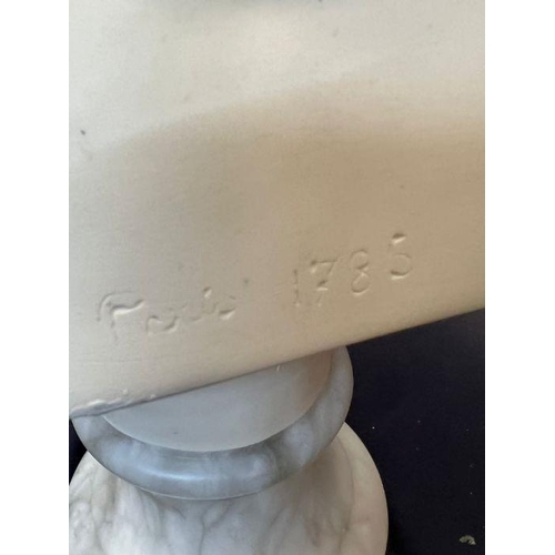 674 - A bust of a boy on a marble base signed Houdon 1875