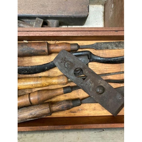 675 - A green painted tool chest containing a selection of vintage tools and planes