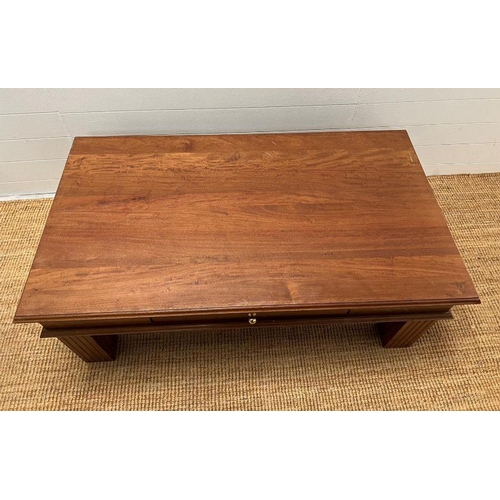 86 - A hardwood coffee table with drawer to centre (H48cm W130cm D74cm)