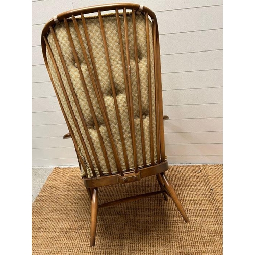 90 - An Ercol blonde evergreen high back chair