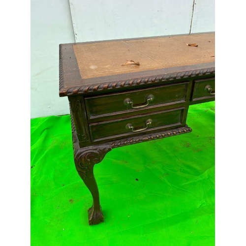 93 - A mahogany desk on ball and claw feet AF (H80cm W160cm D80cm)