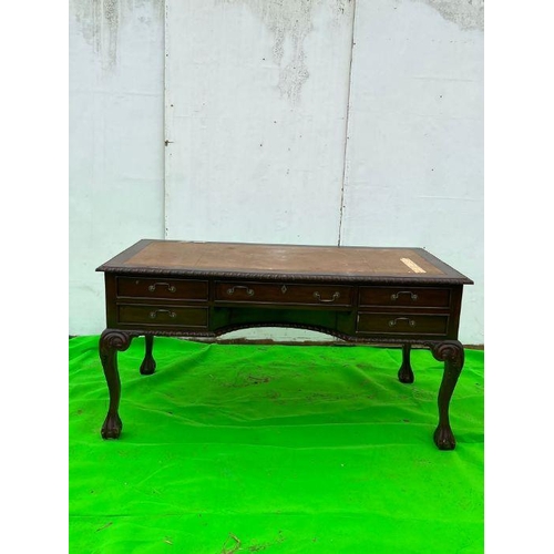 93 - A mahogany desk on ball and claw feet AF (H80cm W160cm D80cm)