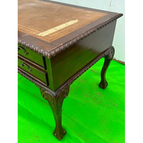 94 - A mahogany desk on ball and claw feet (H80cm W160cm D80cm)