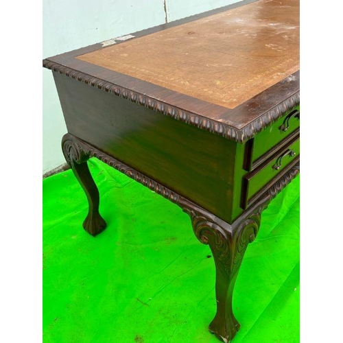 94 - A mahogany desk on ball and claw feet (H80cm W160cm D80cm)