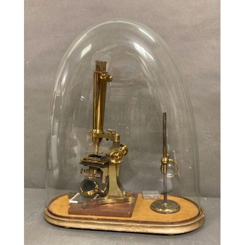 723 - A 19th Century Wenham binocular petrological microscope by Ross of London, cased on plinth in a glas... 