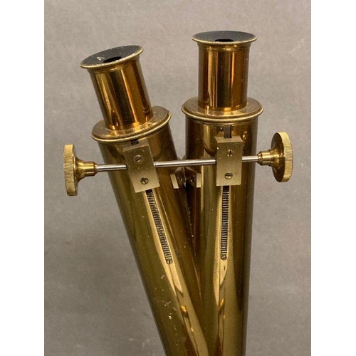 723 - A 19th Century Wenham binocular petrological microscope by Ross of London, cased on plinth in a glas... 