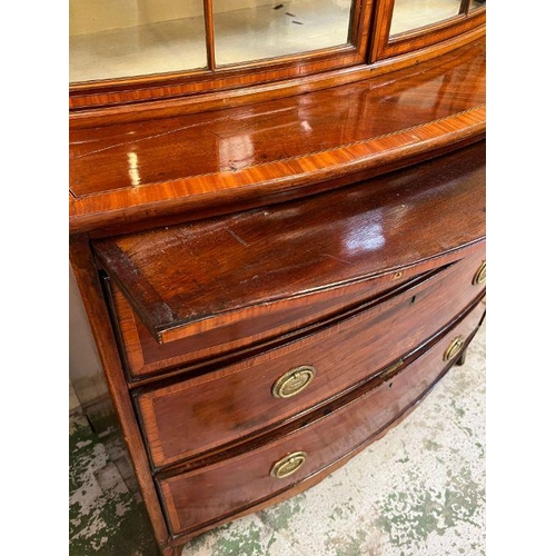 1 - A bow fronted secretaire style bookcase with three graduating drawers (H190cm W103cm D49cm)