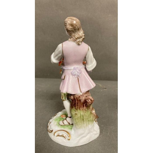 101 - Two hand painted Dresden figurines, a gentleman with a dog and a lady with flower (H15cm)