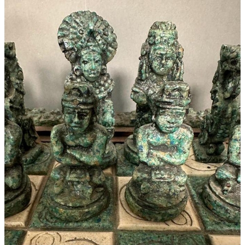 103 - A large Aztec and Spanish wooden resin chess set