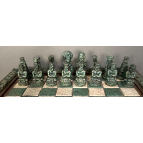 103 - A large Aztec and Spanish wooden resin chess set