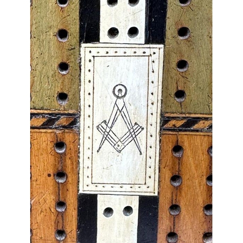 104 - A very interesting Victorian cribbage board made of Various woods with the Masonic set Square and co... 