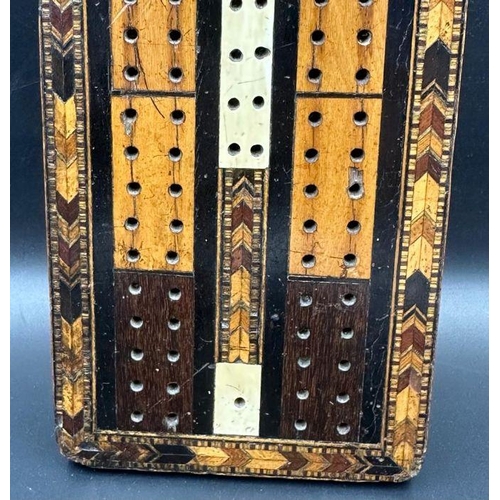 104 - A very interesting Victorian cribbage board made of Various woods with the Masonic set Square and co... 