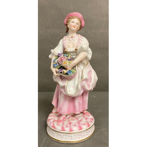 105 - An 19th Century Bisque figure of a lady holding flowers