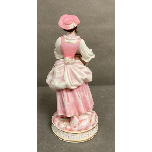 105 - An 19th Century Bisque figure of a lady holding flowers