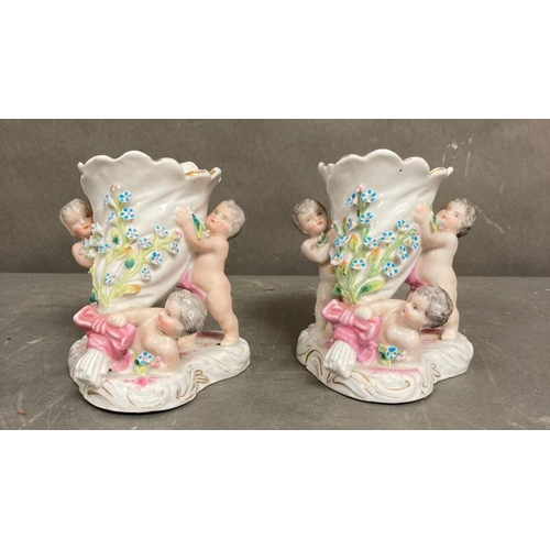 106 - A pair of 19th Century French Putti vases H12cm